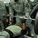 Service members participate in weightlifting competition