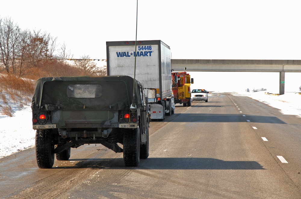Illinois National Guard, State Troopers work to assist stranded motorists