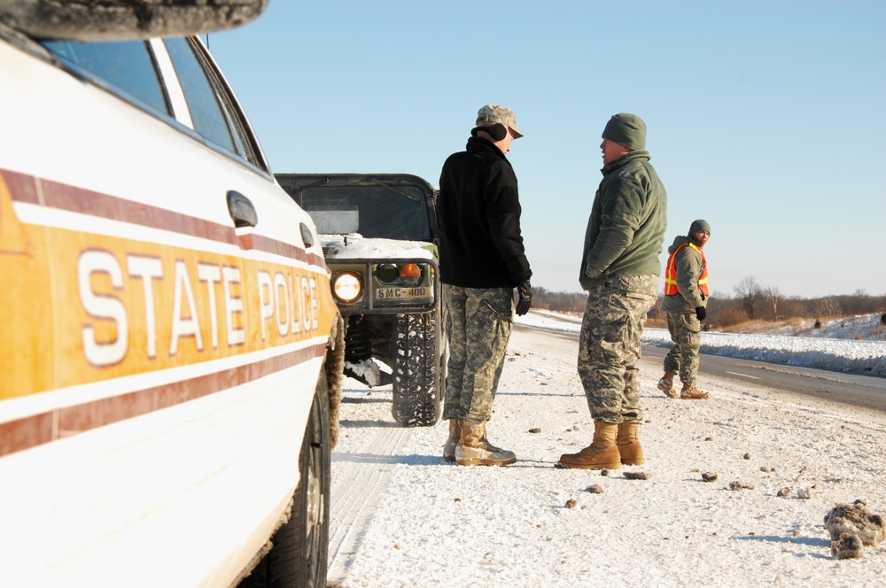 Illinois National Guard, State Troopers work to assist stranded motorists