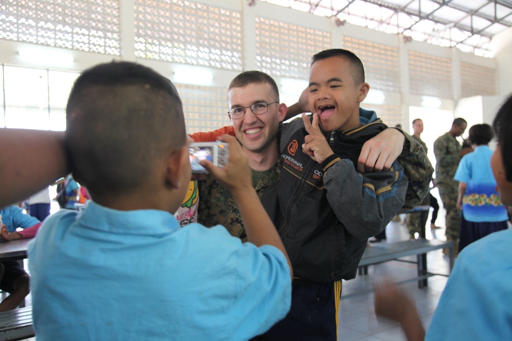 Marine Aircraft Group 36 Marines visit disabled children during Cobra Gold 2011