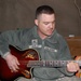 Finger-pickin’ good: Soldier strums guitar, writes songs from his heart