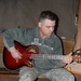 Finger-pickin’ good: Soldier strums guitar, writes songs from his heart