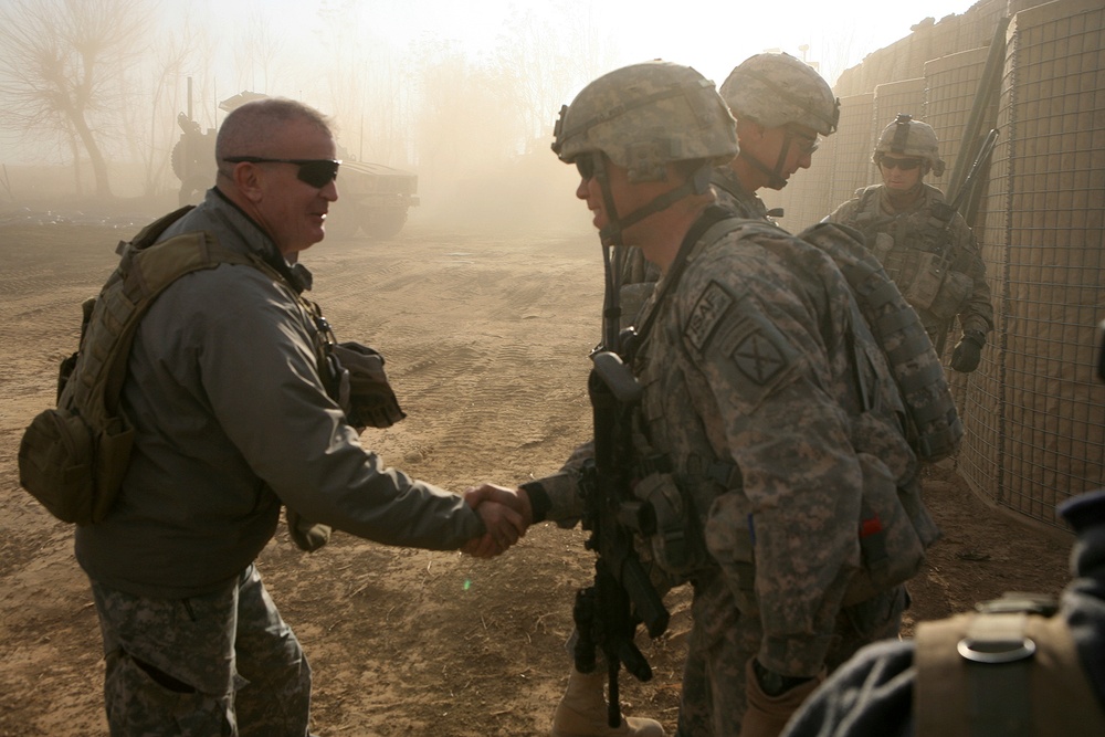 ISAF Regional Command North deputy commander meets with a US soldier in Gor Tepa