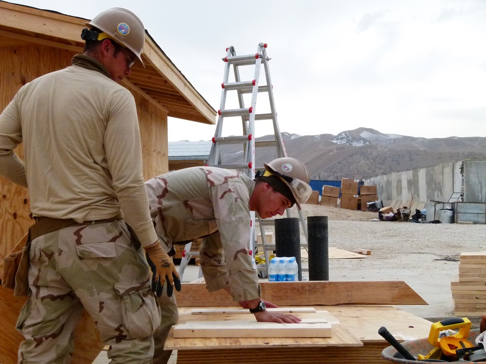 Sailors from U.S. Navy Mobile Construction Battalion 40 build new facilities at FOB Ghowrmach