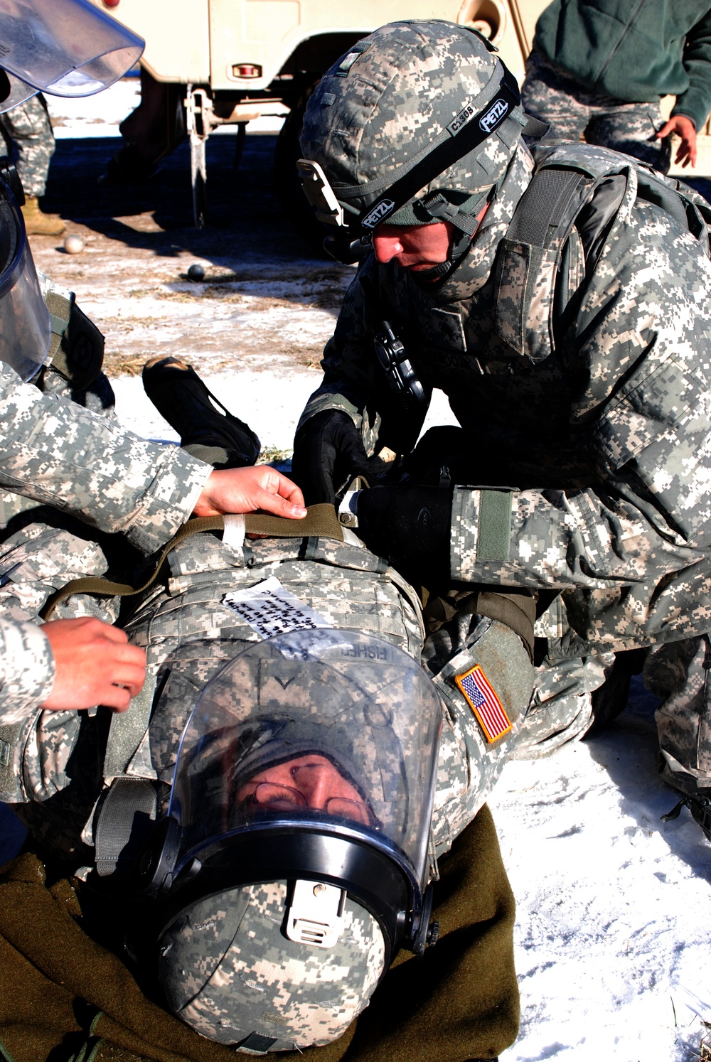 New Mexico National Guard medics practice treating soldier during exercise