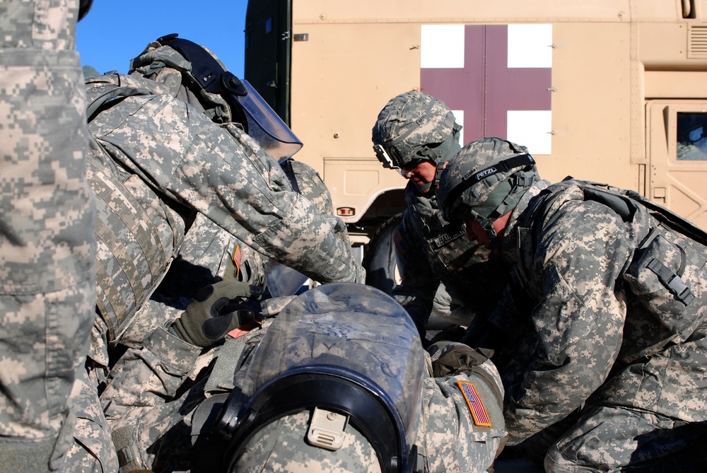 New Mexico National Guard medics practice treating soldiers during training exercise