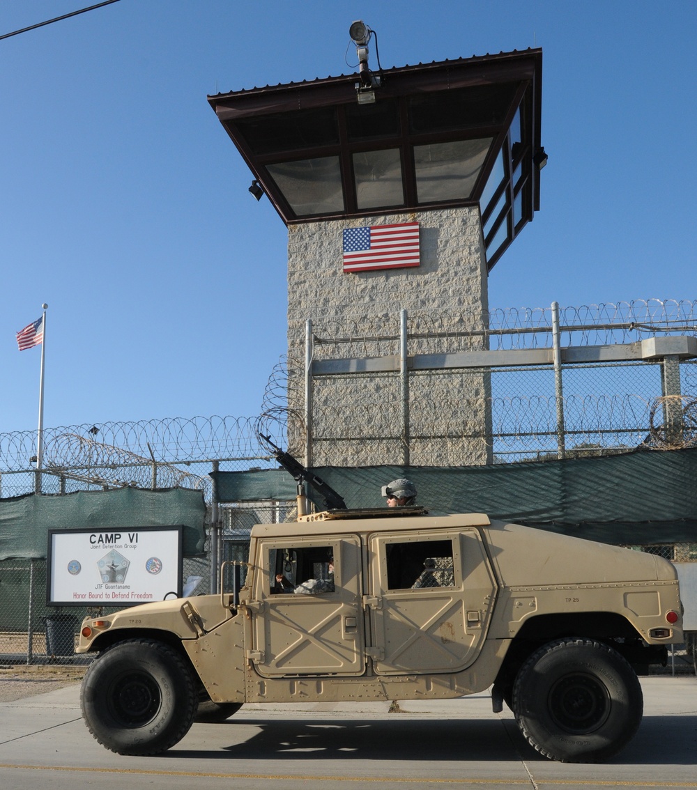 Members of the Company Bravo 1/296 Infantry Regiment of the Puerto Rico National Guard patrol outside the Camp Six entry point