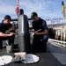 USS Oklahoma sailors paint submarine