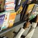 A detainee looks through books offered to him from the detainee library in Camp Five