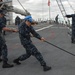 USS Mitscher Sailors Heave a Line