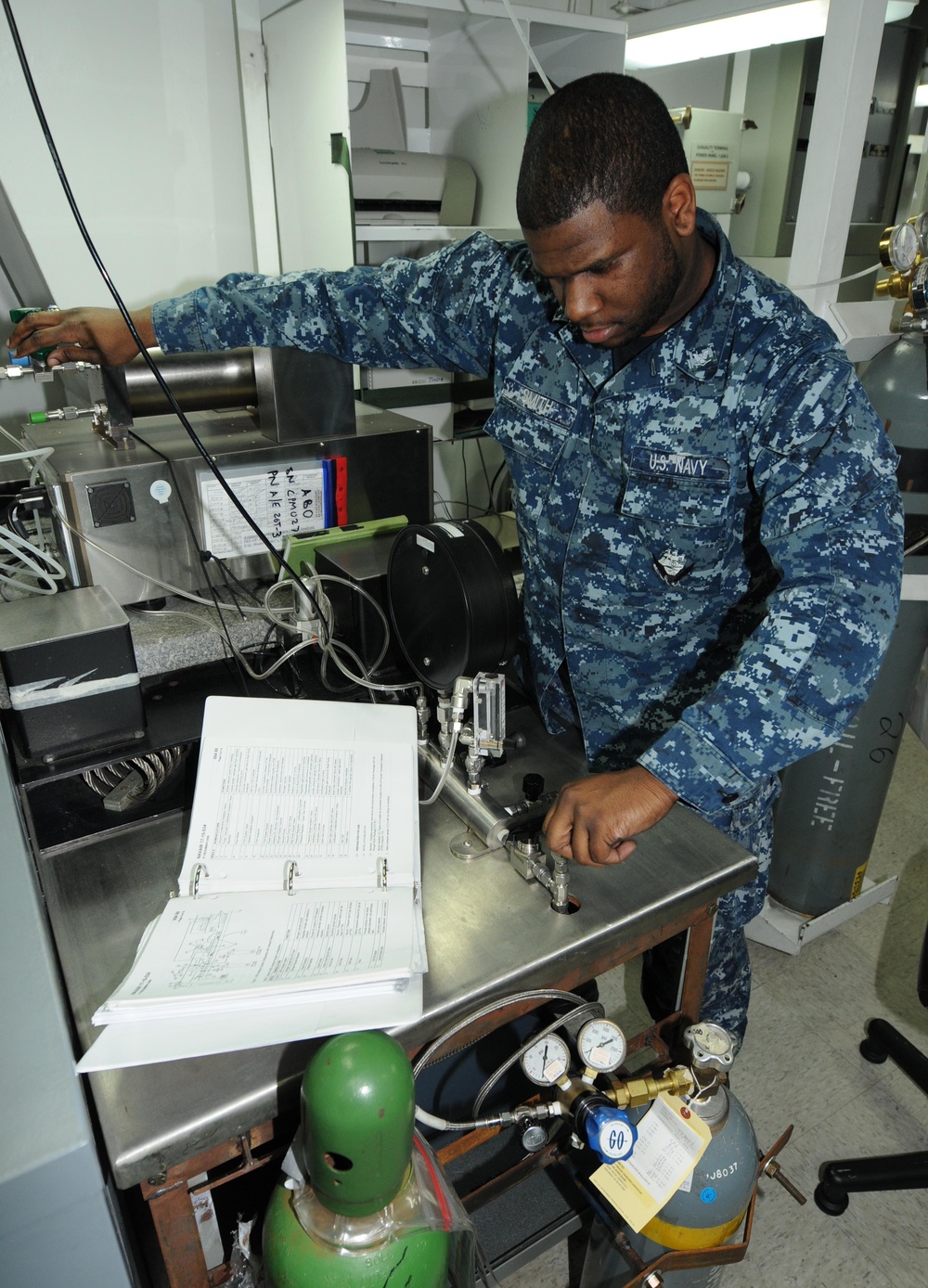 USS George H.W. Bush Sailor Performs Maintenance on Oxygen Analyzer