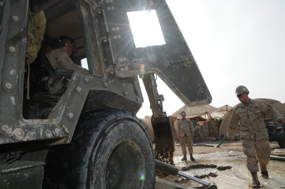 Seabees work to remove water from Afghanistan Rain