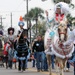 Participants march in the Anheuser-Busch Washington's Birthday Parade in Laredo