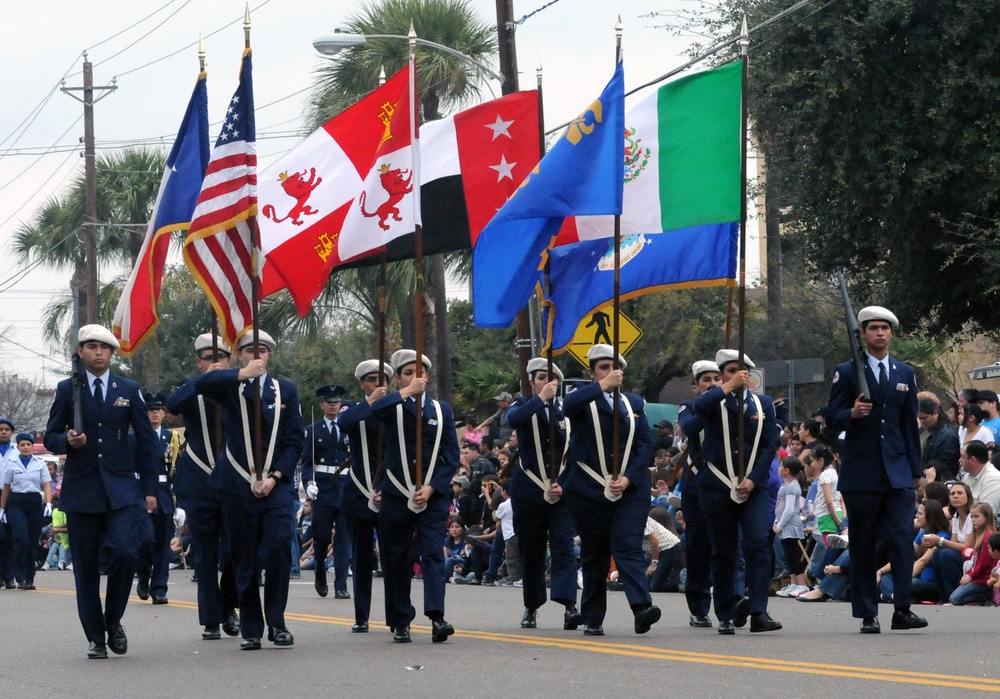 Participants march in the Anheuser-Busch Washington's Birthday Parade in Laredo