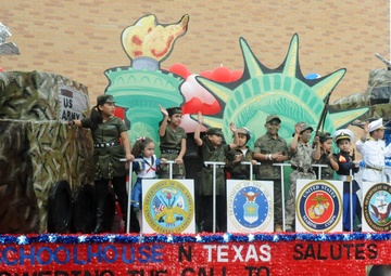 Participants march in the Anheuser-Busch Washington's Birthday Parade in Laredo