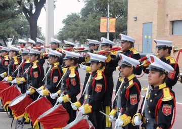 Participants prepare to march in the Anheuser-Busch Washington's Birthday Parade in Laredo