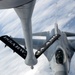 185th KC-135 performs aerial refueling of 132nd F-16s during deployment in Australia.