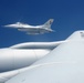 185th KC-135 performs aerial refueling of 132nd F-16s during deployment in Australia.