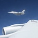 185th KC-135 performs aerial refueling of 132nd F-16s during deployment in Australia.