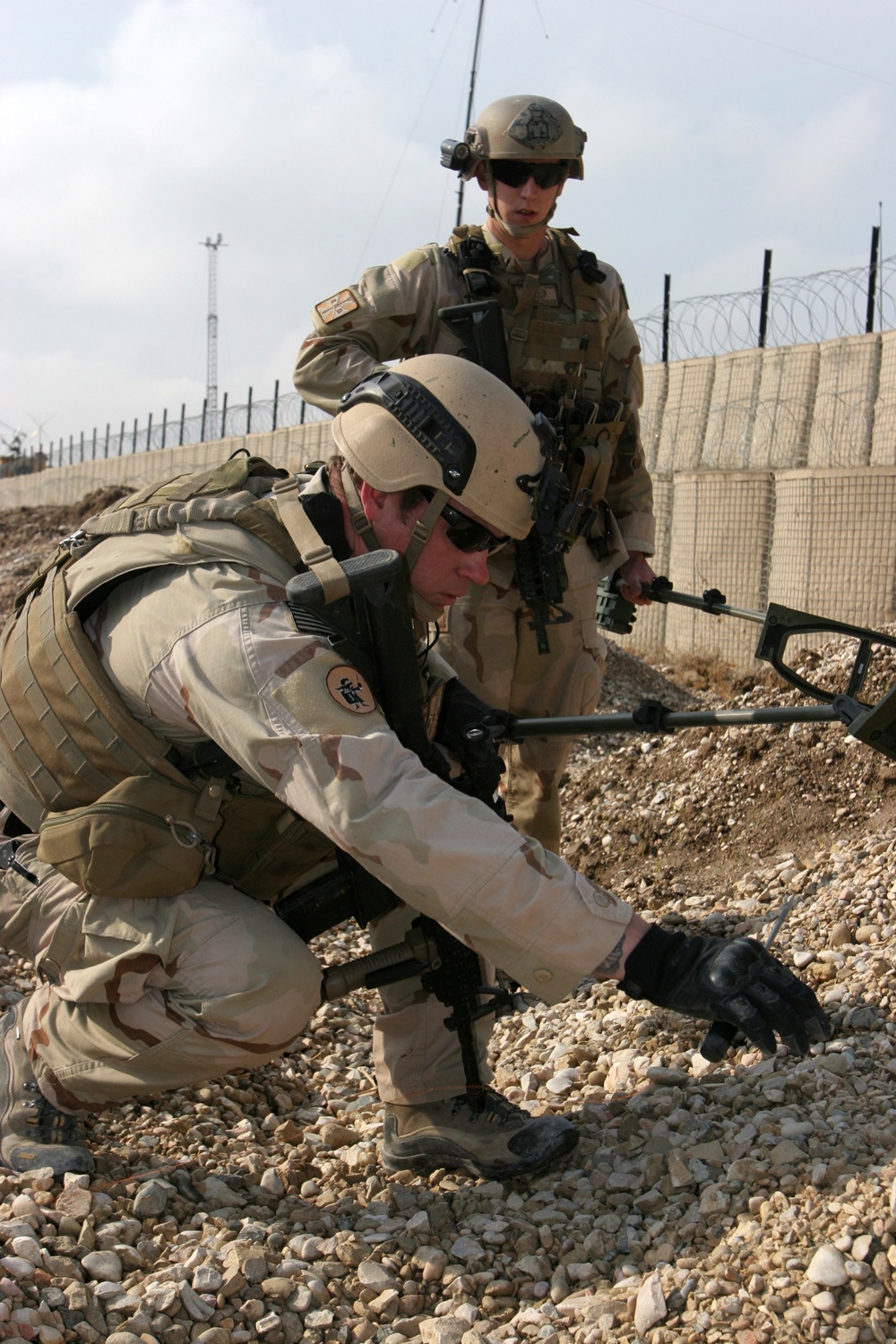 US Navy EOD technicians identify possible signs of IEDs on their training lane at Camp Griffin.