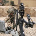 A US Navy EOD technician demonstrates the capabilities of their remote-controlled robot, used for inspecting IEDs