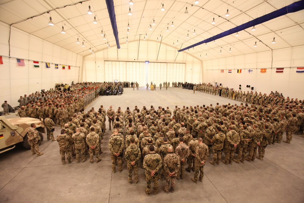 Over 300 soldiers and guests attend the ISAF Regional Command North change of command ceremony