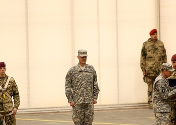 Commander, ISAF US Army Gen. David H. Petraeus pins an award on outgoing ISAF Regional Command North Commander German Army Maj. Gen. Hans-Werner Fritz during a change of command ceremony