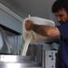 Dairy specialist demonstrates micro-dairy production.