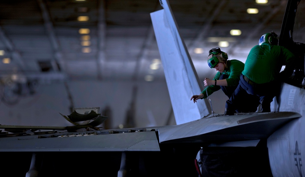 Sailor Performs Maintenance on a F/A-18F Super Hornet