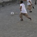 Detainees play soccer in the recreation area of Camp Six
