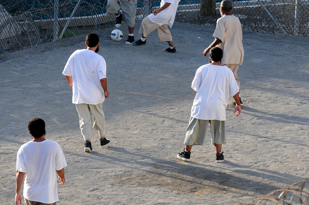 Detainees play soccer in the recreation area of Camp Six at Joint Task Force Guantanamo