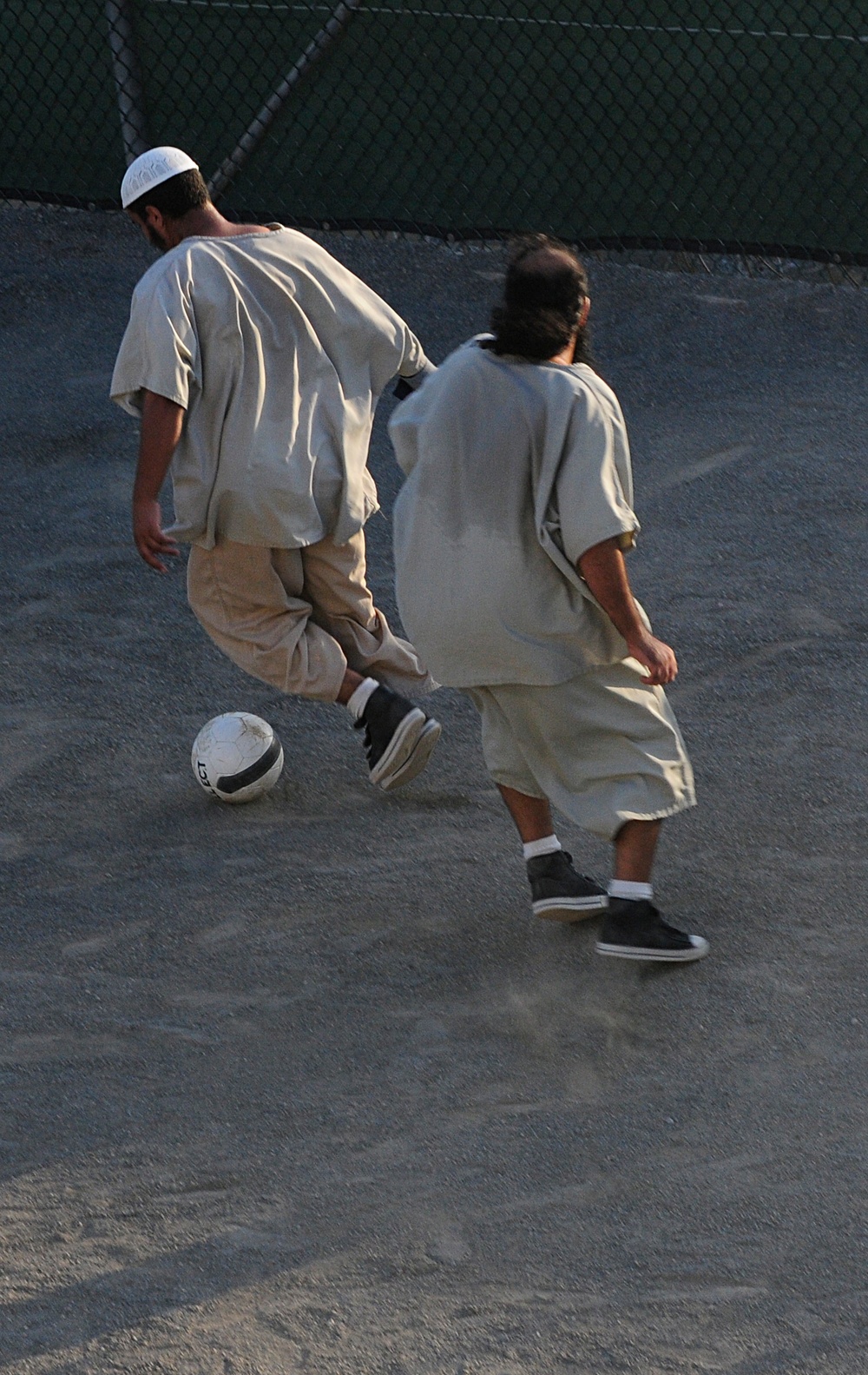 Detainees play soccer in the recreation area of Camp Six