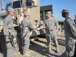 Commanding general gives coins of excellence for outstanding achievement
