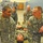 432nd CA BN prepares for deployment to Afghanistan U.S. Army soldiers are engaged in a medical or combat lifesaver training exercise inside what appears to be a gymnasium or training facility. Two soldiers identified by name tapes as 'Miranda' and 'Lauder' are kneeling beside a soldier lying on the floor, practicing casualty handling or patient movement techniques. Additional soldiers and an instructor observe in the background while other training groups are visible throughout the room.