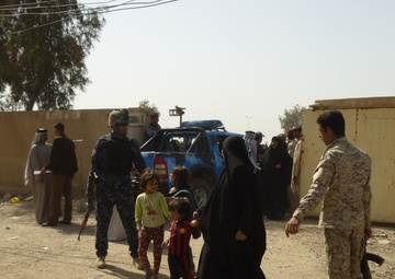 Iraqi Security Forces distribute humanitarian aid in Kadamiyah