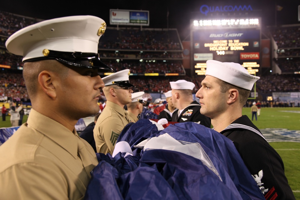 1st MLG Marines, sailors unfurl American flag at Holiday Bowl