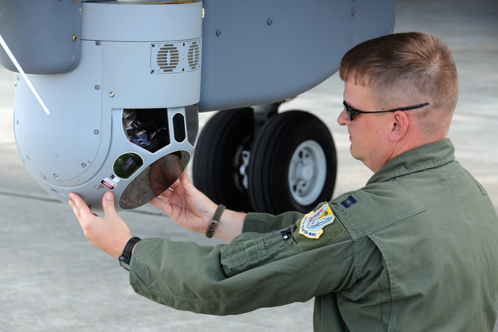 RC-26B Missions Systems Operator conducts preflight optics inspection