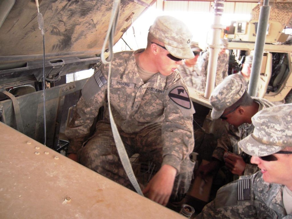 “Saber” Squadron Troopers maintain vehicles in deployed environment