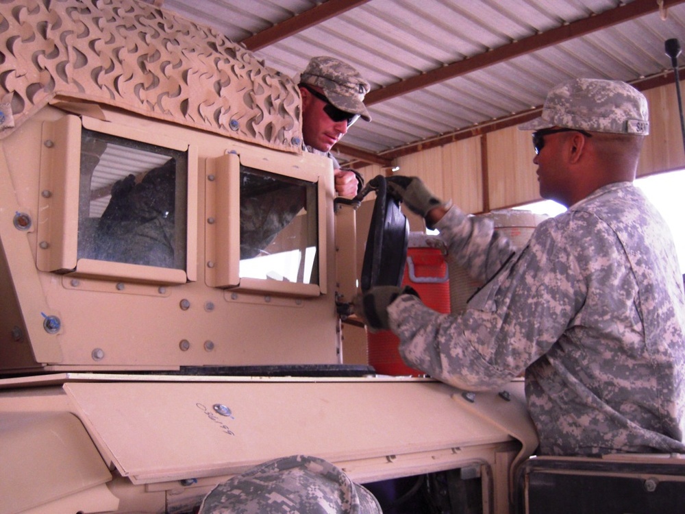 “Saber” Squadron Troopers maintain vehicles in deployed environment