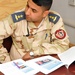 Iraqi Air Force technicians receive first aid training from U.S. Army medics