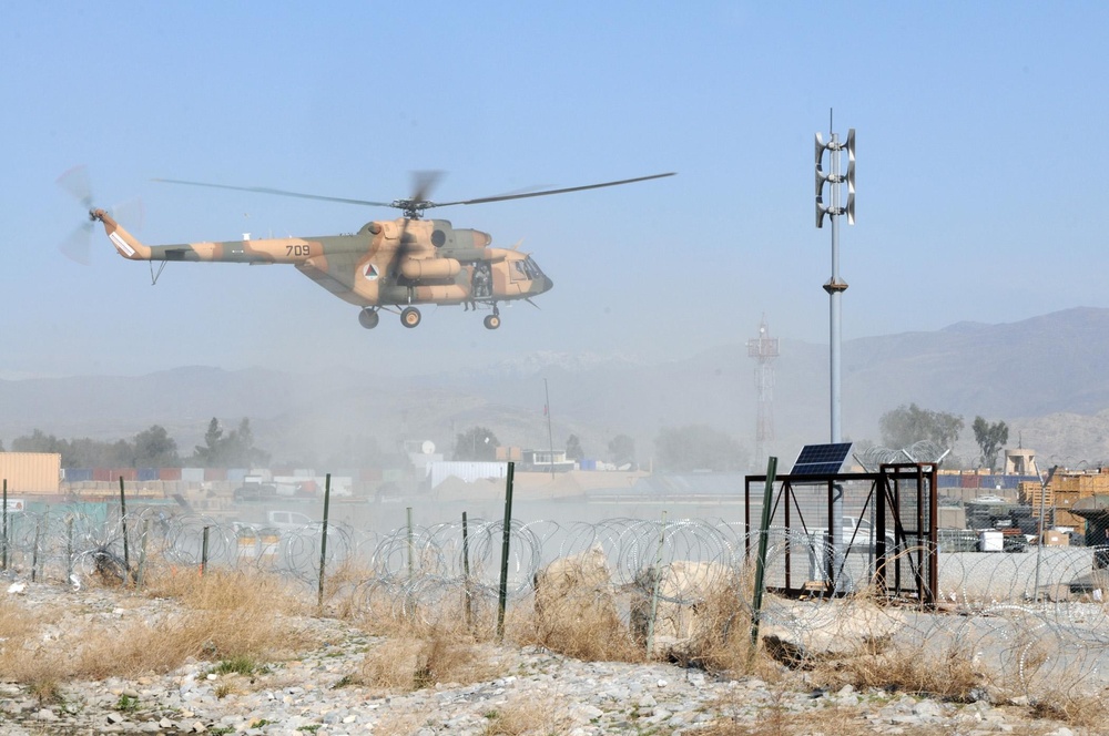 Afghan forces resupply troops with food, ammo