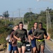 Service members from Naval Station Guantanamo and Joint Task Force Guantanamo participate in a teambuilding run