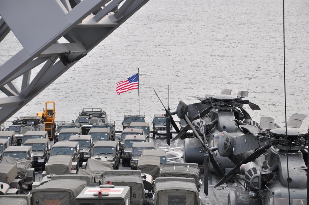 Vehicles Cover the USS Tortuga's Deck