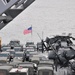 Vehicles Cover the USS Tortuga's Deck