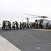 Sailors and Marines Load Supplies Aboard the USS Ronald Reagan