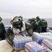 Sailors and Marines Load Supplies Aboard the USS Ronald Reagan