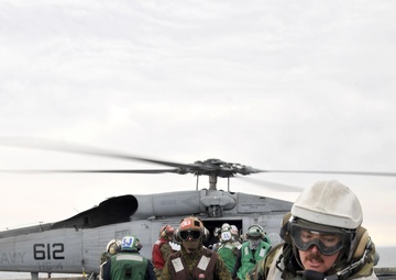Sailors and Marines Load Supplies Aboard the USS Ronald Reagan