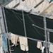 A detainee rests in the outdoor recreation area of Camp Six at Joint Task Force Guantanamo
