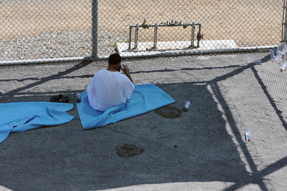 A detainee relaxes in the outdoor recreation area of Camp Six at Joint Task Force Guantanamo
