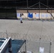 A detainee walks in the outdoor recreation area of Camp Six at Joint Task Force Guantanamo